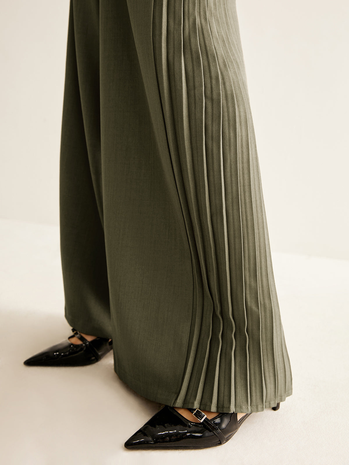 Pantalon large à plis latéraux
