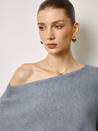 Pull oversize à col asymétrique et manches bouffantes