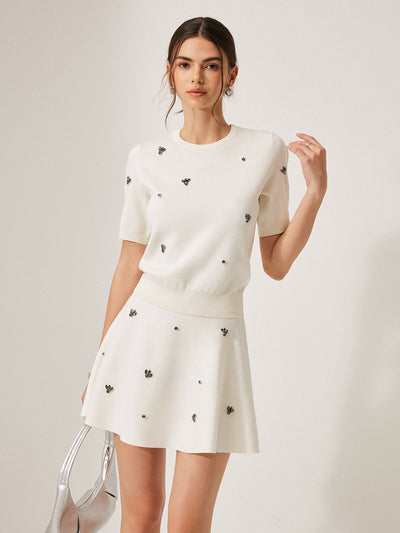 Pull à manches courtes avec détails métalliques