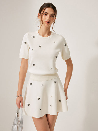 Pull à manches courtes avec détails métalliques