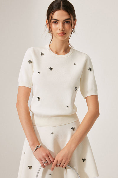 Pull à manches courtes avec détails métalliques
