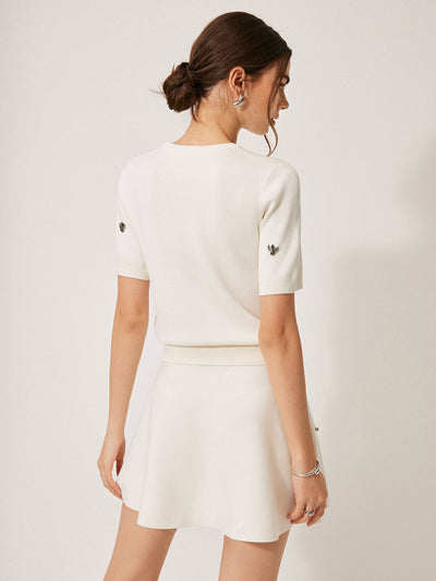 Pull à manches courtes avec détails métalliques
